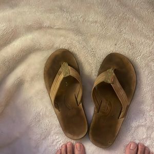 Men’s used rainbow flip flops